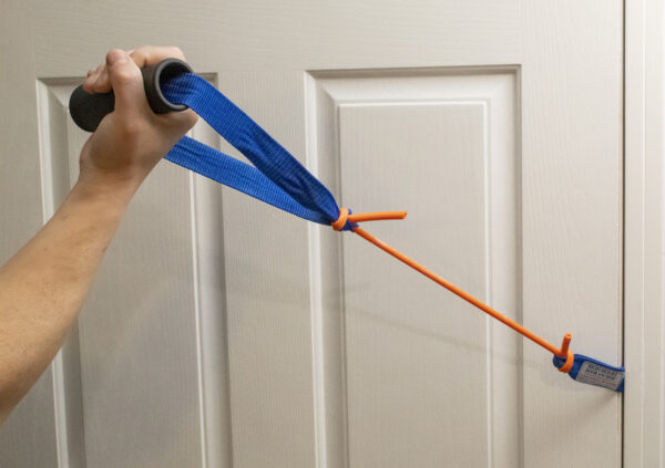 A person using a RangeMaster Handle for Tubing and Banding (10 Pack) to open a door.