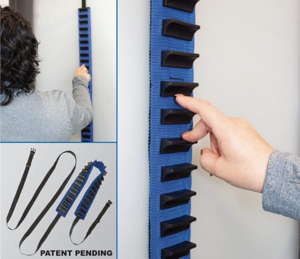 A person is holding a Shoulder Finger Ladder on a wall.
